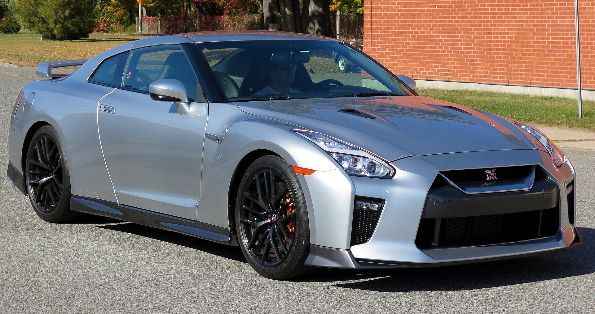 Close-up photo of a performance car grille and headlight